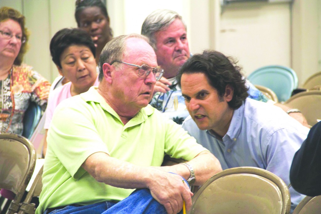ABC Federation of Teacher leaders Gavin Riley and Rueben Mancillas look to be unhappy with the three proposed Trustee Voting Maps that were unveiled during last week’s public meeting at Carmenita Middle School.  Pete Parker Photo