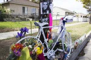 A white bicycle, photos, notes and candles are placed at the scene of the crash in honor of Norwalk residents Giovanni Chaidez and Rosibel Montoya who died as a result of being struck by a vehicle.  Pete Parker Photo