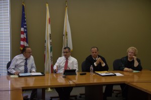 Norwalk City Councilman Luigi Vernola, Mayor Marcel Rodarte, Vice Mayor Leonard Shryock, and Councilwoman Cherri Kelley review city's RV Parking Ordinance at a meeting held this week at Norwalk City Hall. Pete Parker Photo and Article.