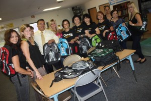 Volunteers gathered at the Willow Education Center on Thursday to help distribute hundreds of new backpacks for students in the ABCUSD.  The group includes Dina Alcantar, Irene So, Jill Wang, Reeza Gervacio, Pauline Kong, Niki Shah, Josie Troung with LBS Financial, Amanda Criscuolo from Broadview Mortgage, Rachel Holborn with Old Republic.  Also in the photo in the center is the groups co-chairman Mark Anthony Ruiz with Century Astro Relators.  Randy Economy Photo