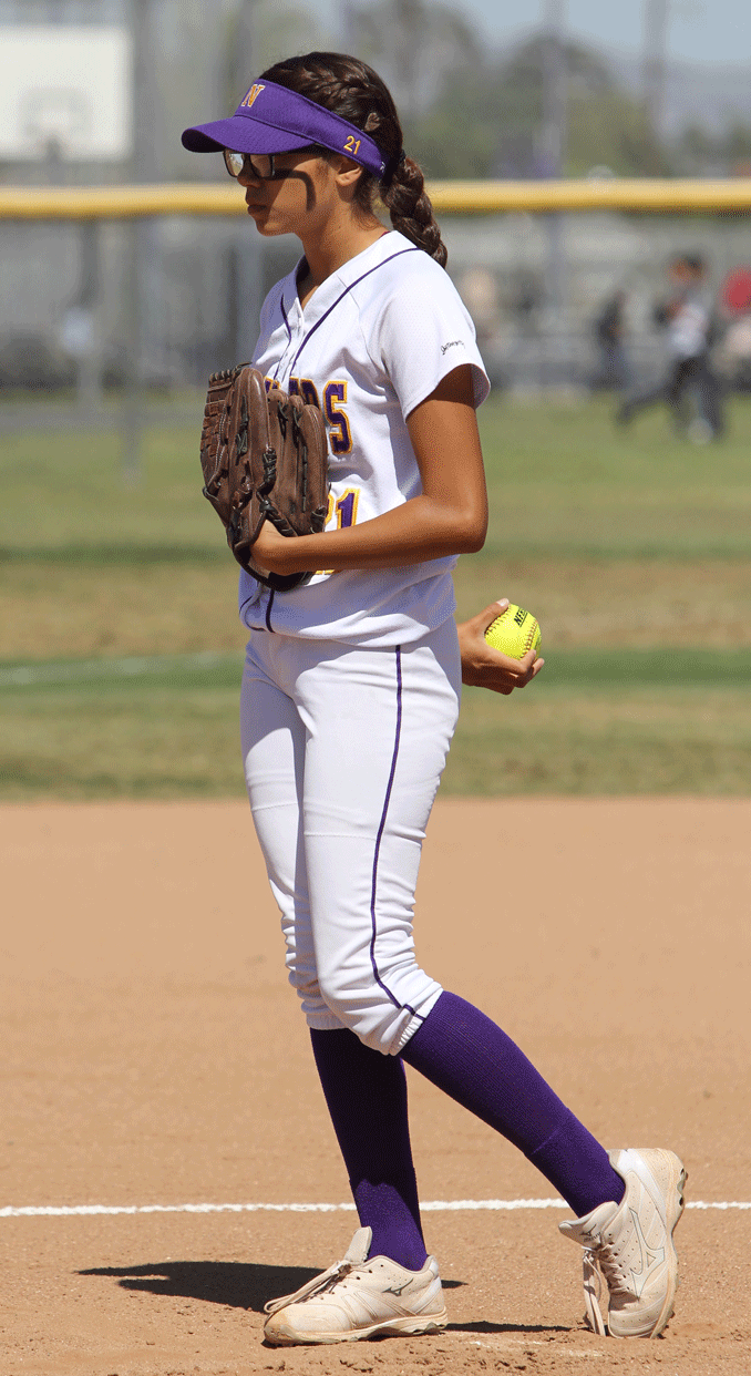 Norwalk High sophomore pitcher Breanna Vasquez pauses for a moment before delivering one of her 93 pitches against John Glernn High last Friday. Vasquez was perfect through the first 16 batters she faced and allowed two hits while striking out 13. She also went two for three as Norwalk edged Glenn 2-0. PHOTO BY ARMANDO VARGAS, Contributing Photographer