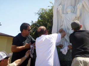 Active Parishioners of Holy Family Artesia gather together to clean up the graffiti that had desecrated the Holy Shrine. Photo by Lupe Sigala.