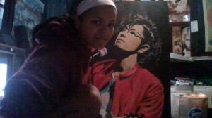 Mitzi Macias with one of her acrylic paintings of Japanese Popstar 'Gackt Camui'.