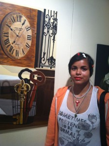Mitzi Macias photo with artwork in background.