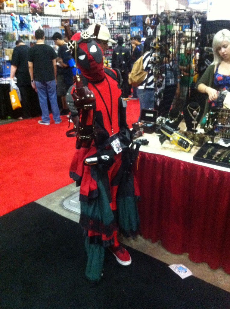 Caption: Deadpool Cosplayer poses for HMG-CN at Anime Expo 2014. Daniel E Beckham Photo.