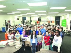 Staff and children of Studebaker Elementary [above] were visited by the "Helpful Honda Guys" to help start their school year right. Deliveries were also made to Benito Juarez Elementary. Principal Monica Johnson is seen here accepting the supplies with the students of Studebaker Elementary. Principal Christine Balbuena of Benito Juarez Elementary was also grateful for the donation. Photo courtesy of Remarq.