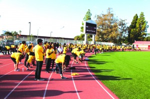 Participants in the 3K Fun Run warm up before the event. The race was held at the Fedde Sports Complex which featured a special course designated just for fun. Participants from Hawaiian Elementary School, Furgeson Elementary School and Melbourne Elementary School averaged 28 persons per school. Artesia High School signed in 60 students. Photo by Tammye McDuff.