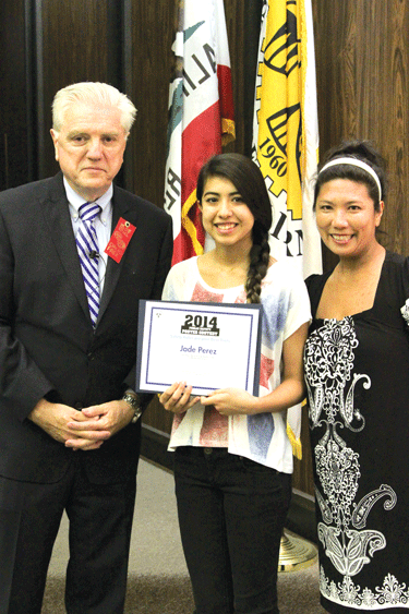 La Mirada Mayor Larry Mowles (left) presents certificate to Jade Perez of La Mirada High School (center) for 1st Place in her age group. At right is Perez' teacher Catherine Guerra.