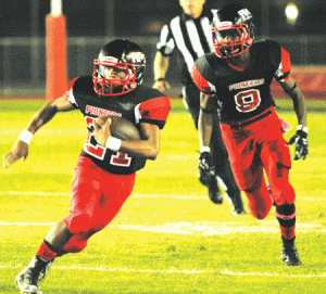 Artesia High junior running back Jordan Benoit is on the run again, picking up some of his 200 yards on one of his 11 carries against Cerritos High last Friday night. Benoit also scored all three touchdowns in the 20-6 victory. PHOTO BY ARMANDO VARGAS, Contributing Photographer