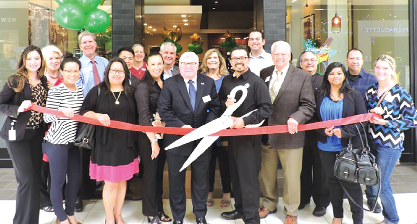 Mayor George Ray and Councilmember Edwards was on hand to help Store Manager Matt (right of Edwards) and District Manager Sharon (left) to cut the ribbon — at Los Cerritos Center. Photos courtesy of Cerritos Regional Chamber of Commerce.