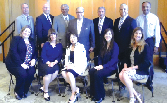 Pictured are (seated from left) Community Participation Manager Connie Hinger, Administrative Assistant Pam Mendoza, Assistant City Manager Kathy Matsumoto, Public Information Manager Laurie Kajiwara, City Clerk Vida Barone. Top row (l-r) City Attorney Mark Steres, Community Safety Manager Daryl Evans, Assistant City Manager Vince Brar, L.A. County Supervisor Don Knabe, City Manager Art Gallucci, Community Development Director Torrey Contreras, Public Works Director Kanna Vancheswaran. Photo courtesy city of Cerritos.