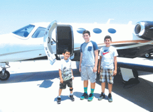 Ismeal Cuevas (r) with his two older brothers Emmanuel and Samuel.  Ismael actually helped fly the Cessna Jet over Long Beach.