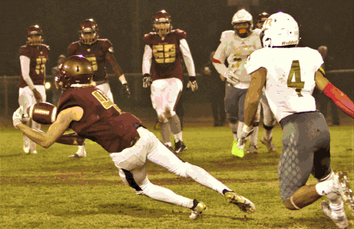 Photo caption: Valley Christian High senior wide receiver Clay D'Amico has a lock on one of his three receptions he caught from junior quarterback Isaac Joseph in last Saturday night's California Interscholastic Federation Southern California 3-A Regionals. The Crusaders lost to The Bishop's School 28-9 as D'Amico was on the receiving end for 35 yards among his three catches.