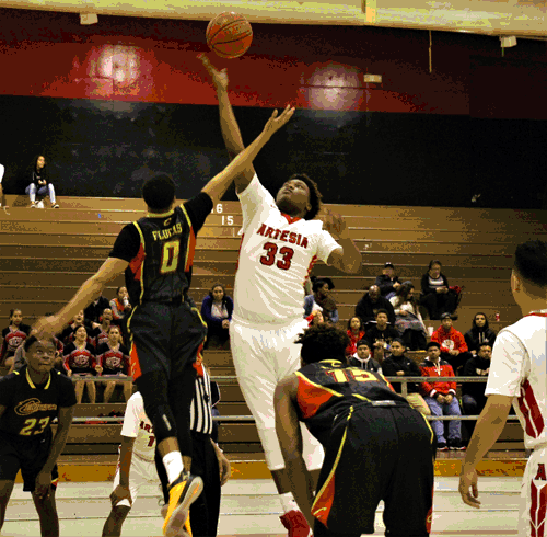 Artesia senior Devion Smith (#33) and Cerritos junior Destin Flucas helped tip off the Suburban League boys basketball schedule last Friday night at Artesia. The visiting Dons won 80-55 behind a team-leading 23 points from Flucas. Smith led Artesia with 27 points. PHOTO BY ARMANDO VARGAS, Contributing photographer