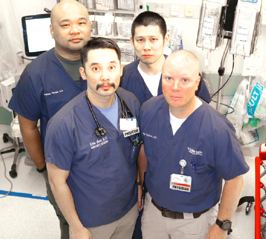 LIFE SAVERS: Front (l-r) Kevin Menes, MD, James Walker, DO. Back (l-r) Patrick Flores, DO, Michael Tang, DO. The four work at Sunrise Hospital in Las Vegas, Sunrise was the closest hospital to the Las Vegas massacre site. Photo courtesy of Kevin Menes.